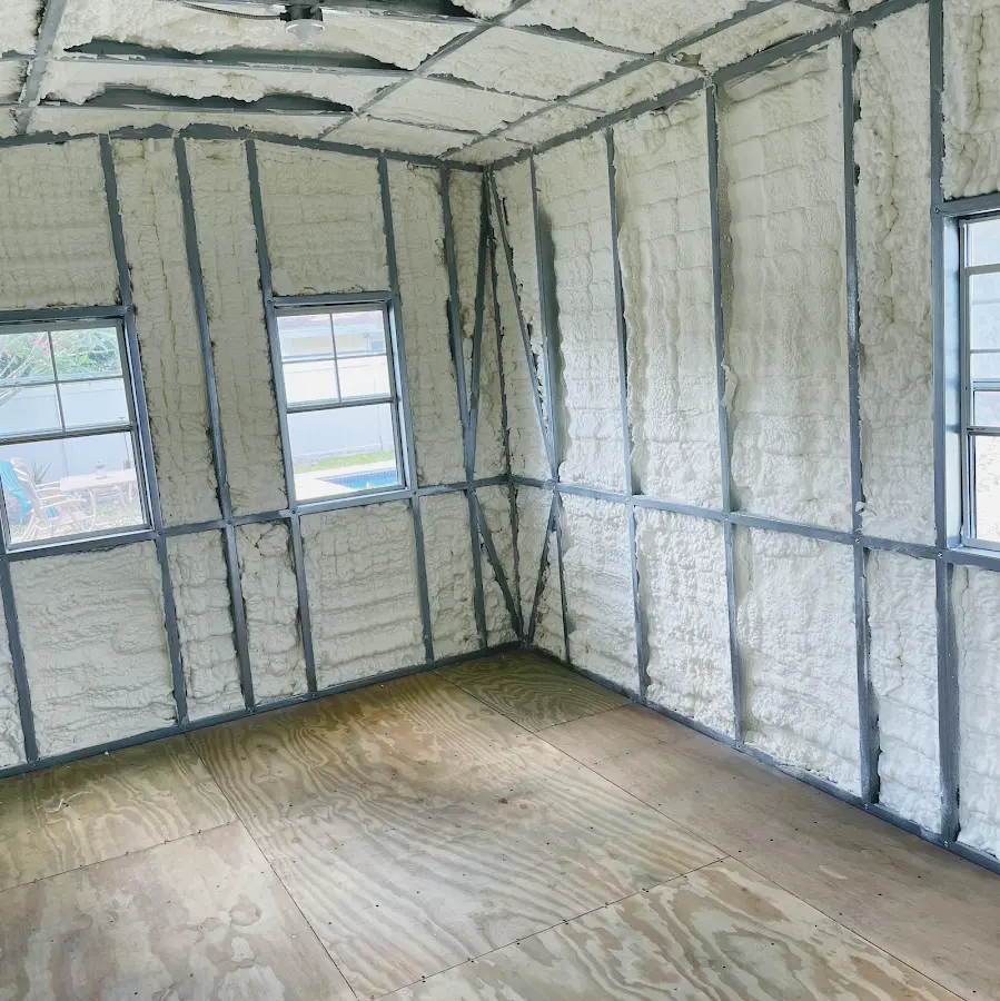 Closed-cell spray foam insulation applied to wall cavities in a residential project in Belmar